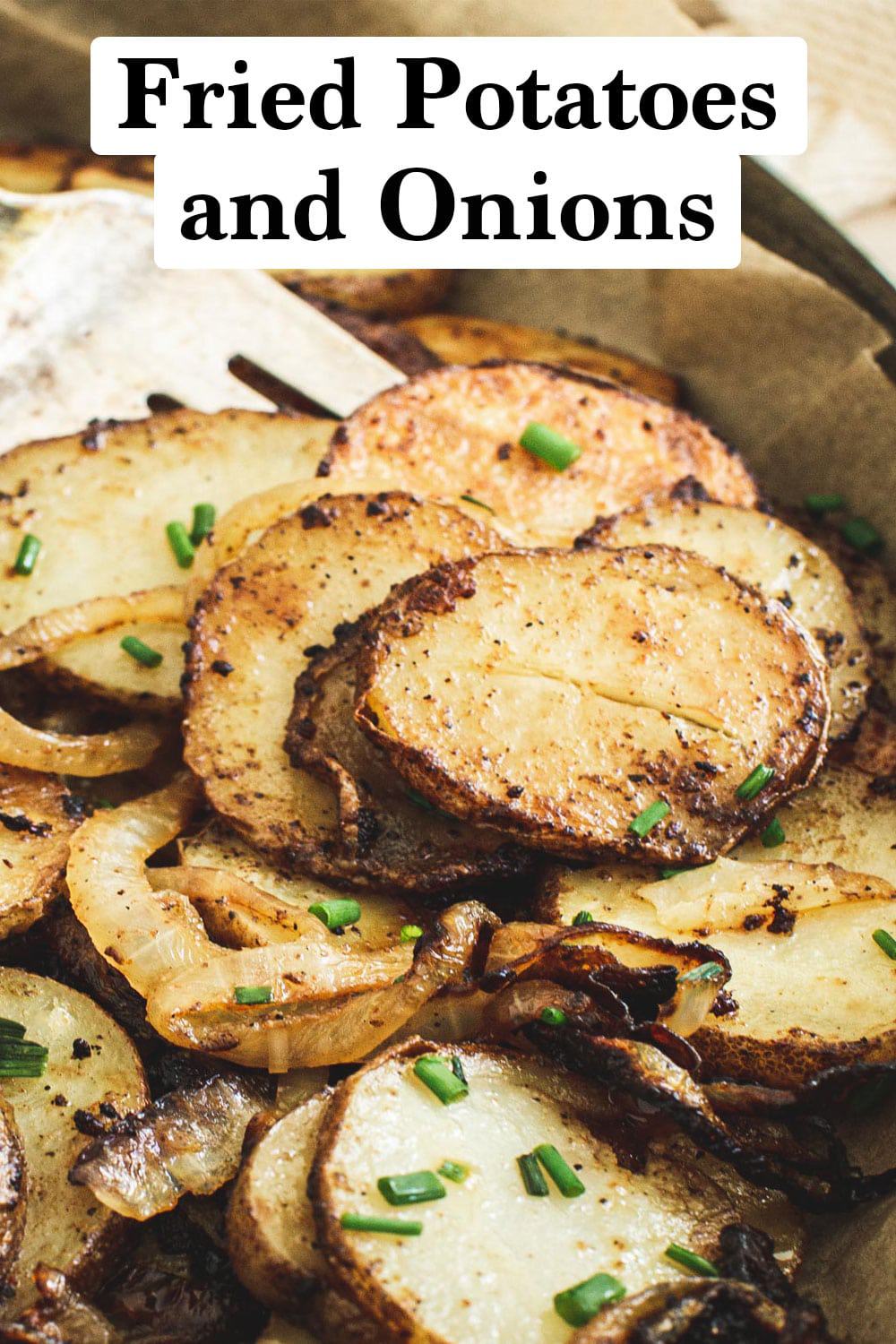 Fried potatoes and onions topped with chives.