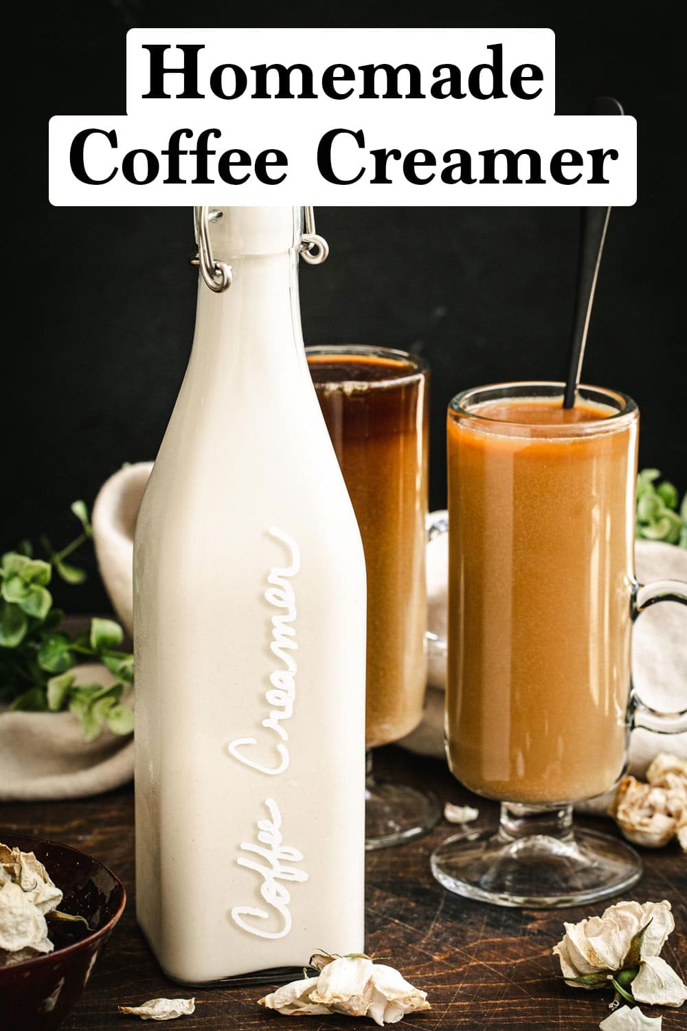 Vegan homemade coffee creamer in a bottle with a cup of coffee next to it.