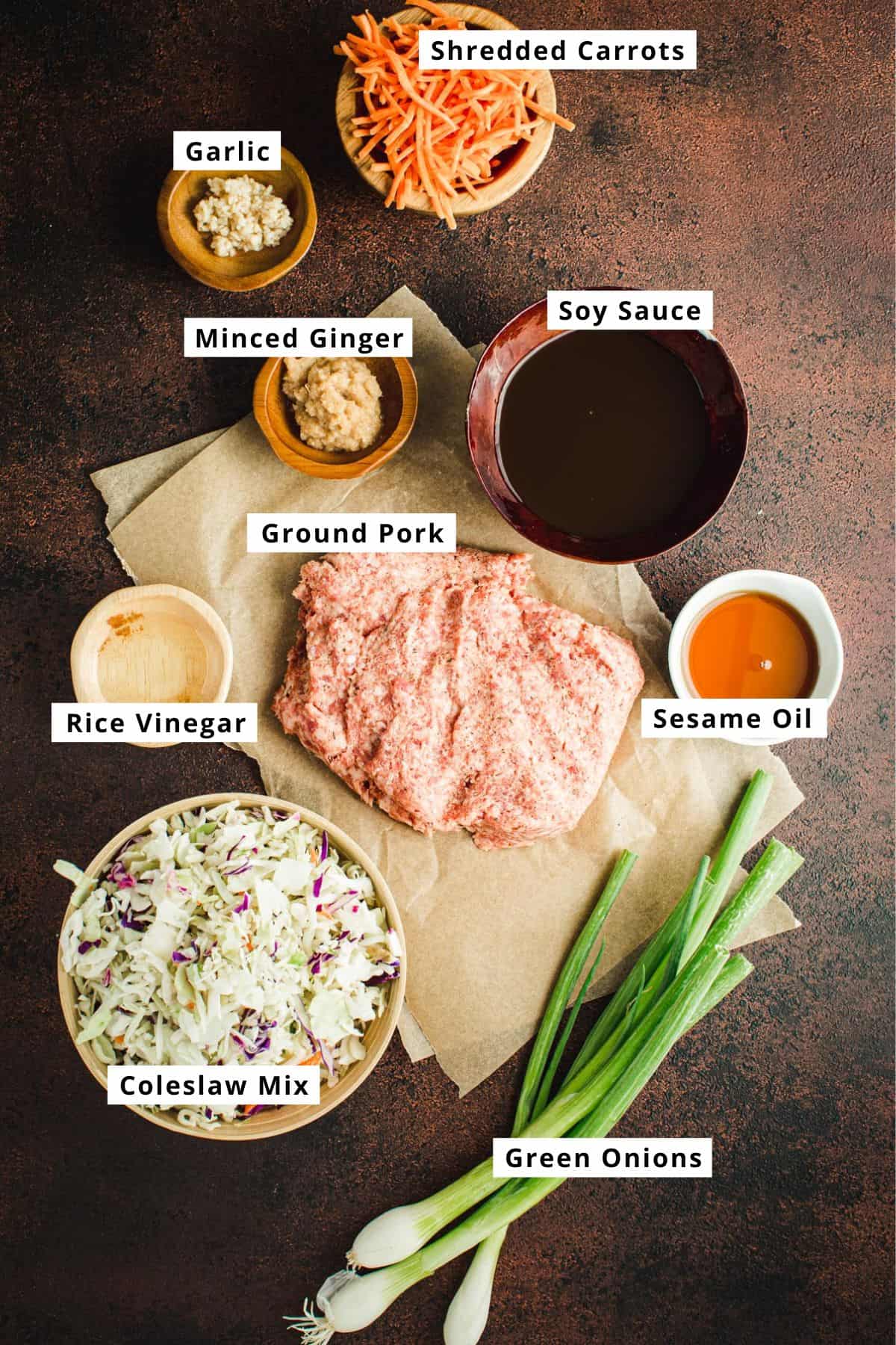Egg roll in a bowl ingredients in various bowls.