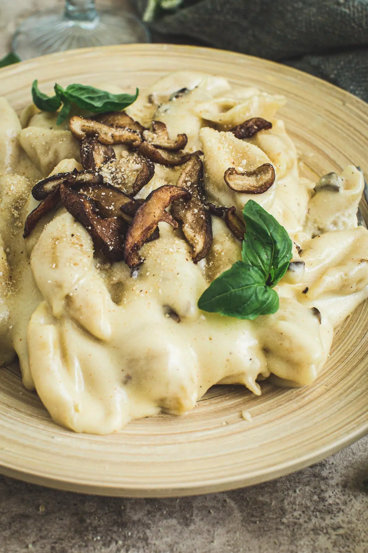 Truffle mac and cheese with mushrooms and breadcrumbs on top.