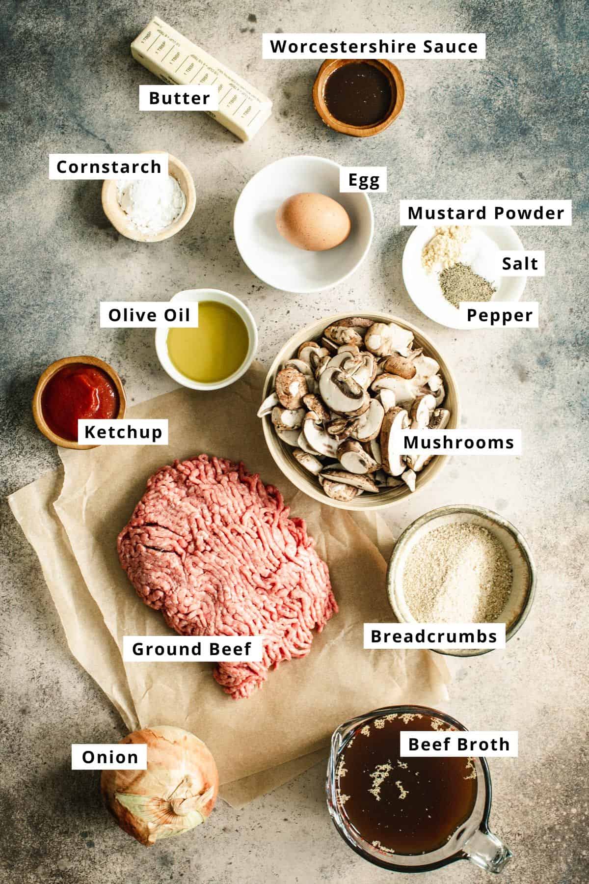 Salisbury steak ingredients in various bowls.
