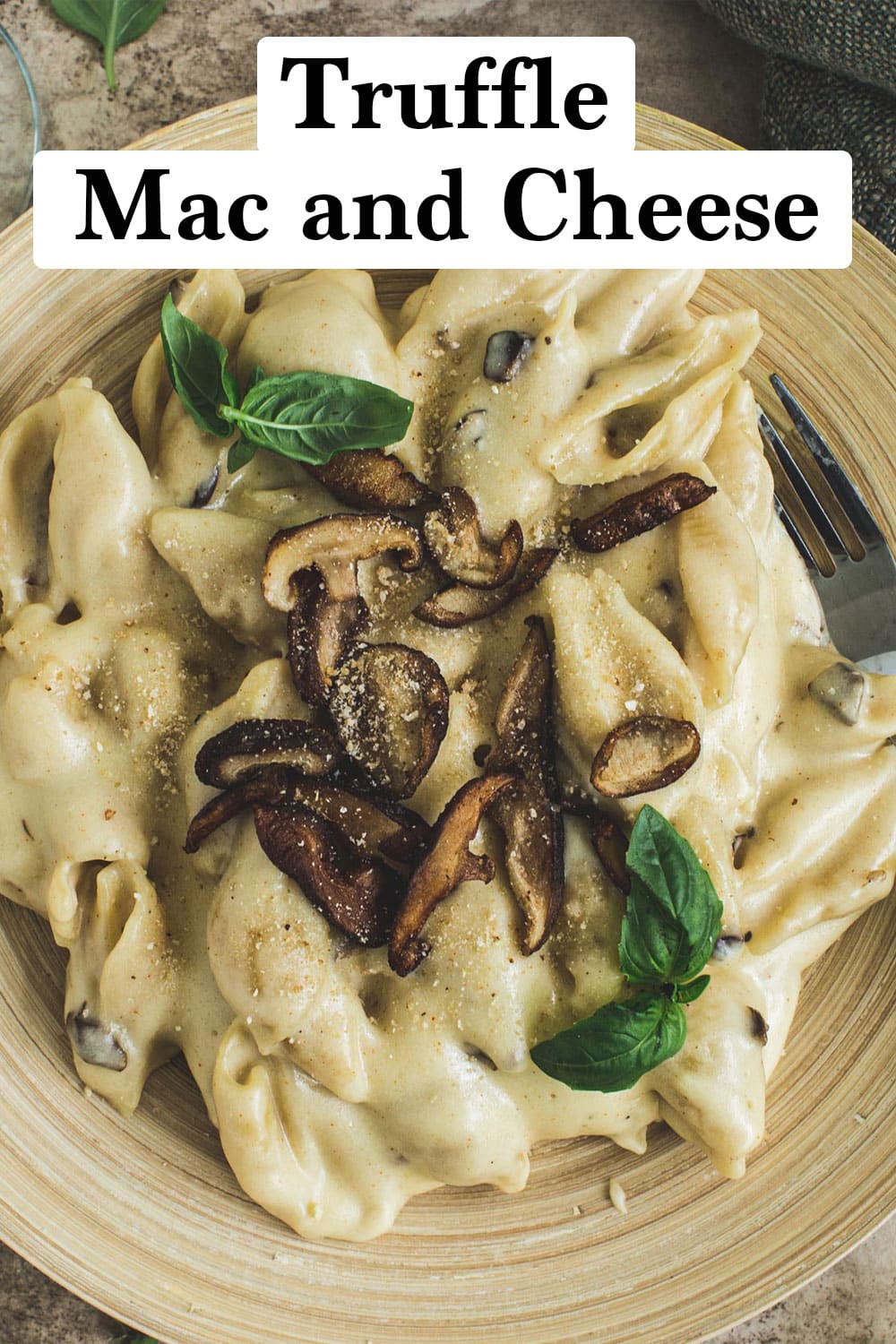 Truffle mac and cheese topped with fresh basil and mushrooms.