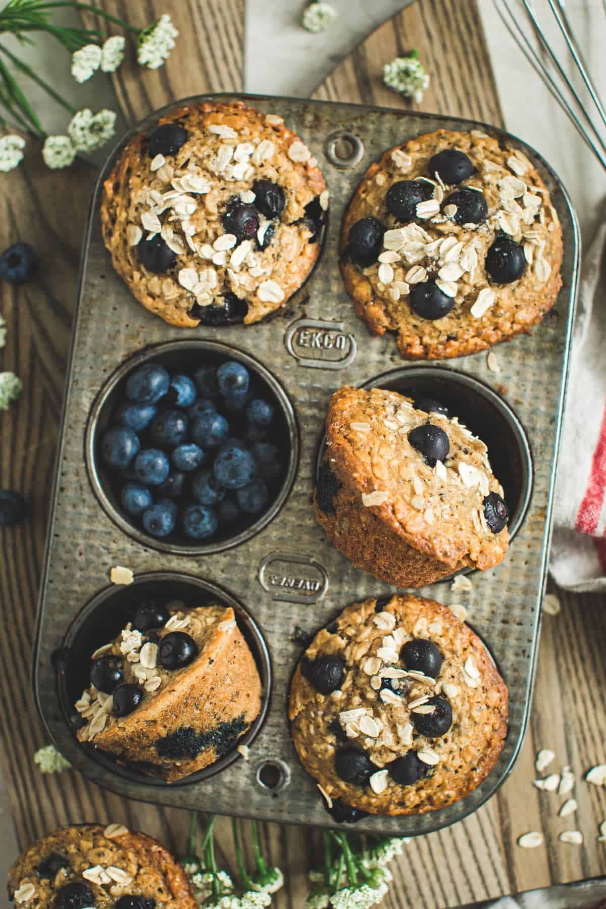 Blueberry oatmeal muffins in a recipe tin.