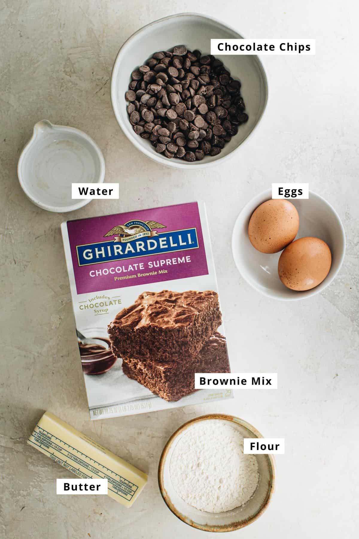 Brownie mix cookies ingredients in various bowls.