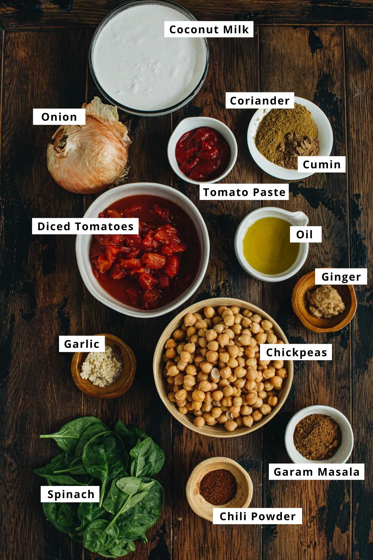 Chickpea curry ingredients in various bowls.
