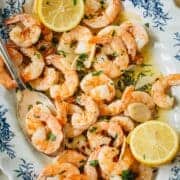 Garlic shrimp scampi on a floral platter.