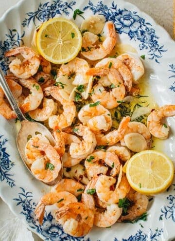 Garlic shrimp scampi on a floral platter.