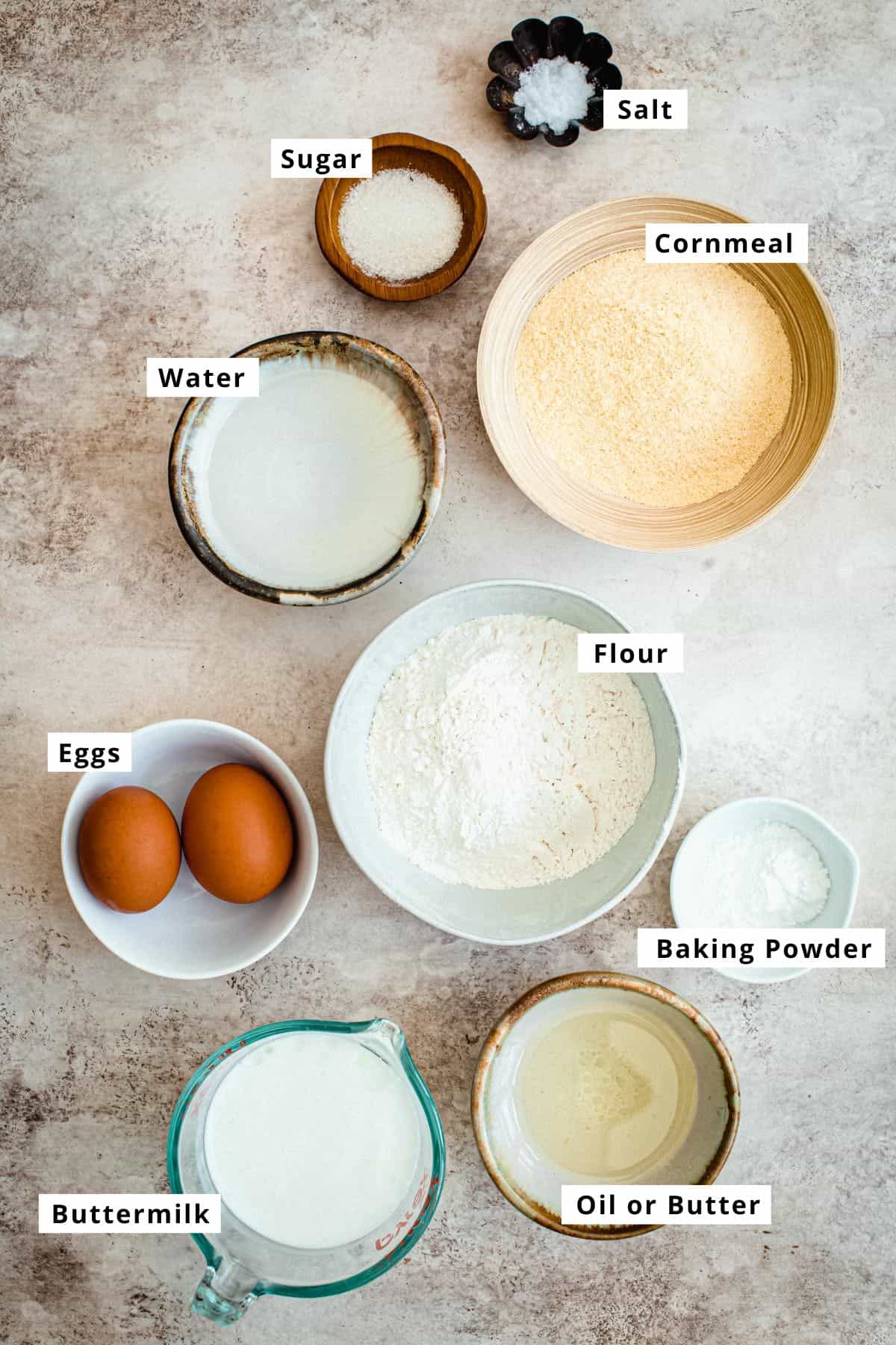 Hoe cakes ingredients in various bowls.