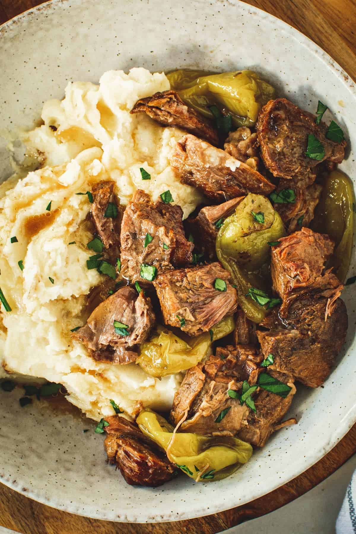 Instant Pot Mississippi pot roast over mashed potatoes.