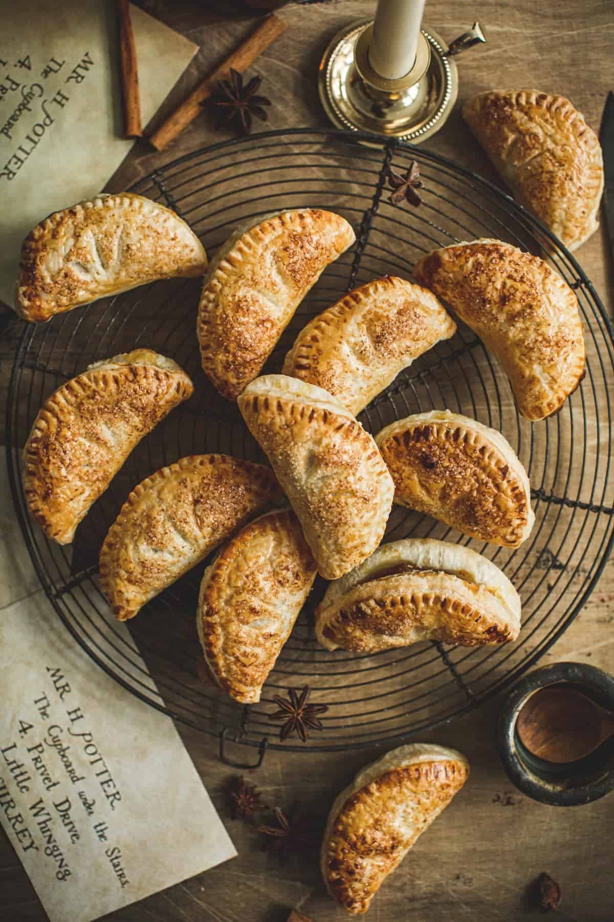 Harry Potter pumpkin pasties on a wire rack.