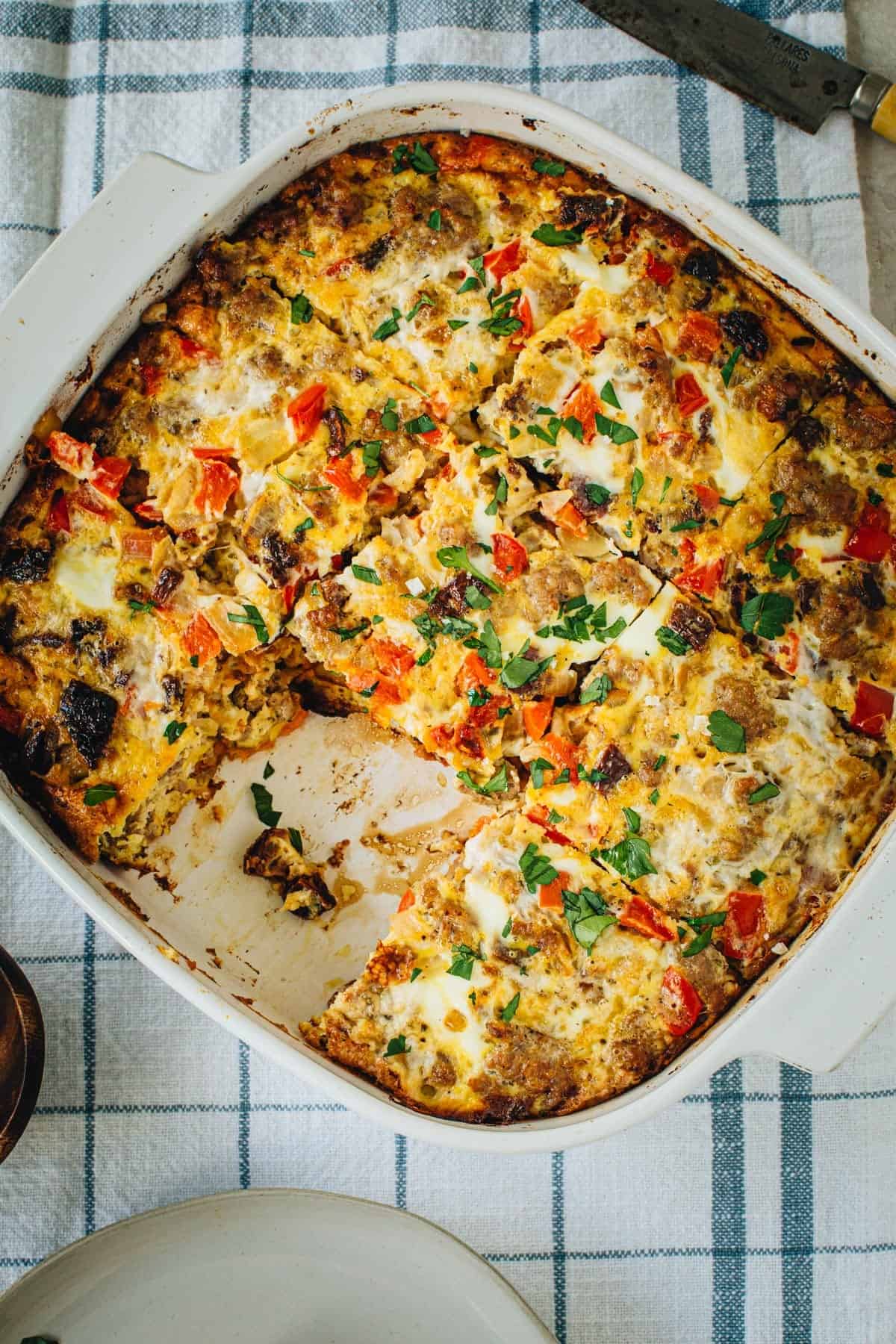 Sausage and egg casserole in a square baking dish.