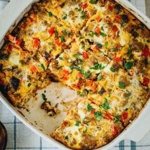 Sausage and egg casserole in a square baking dish.