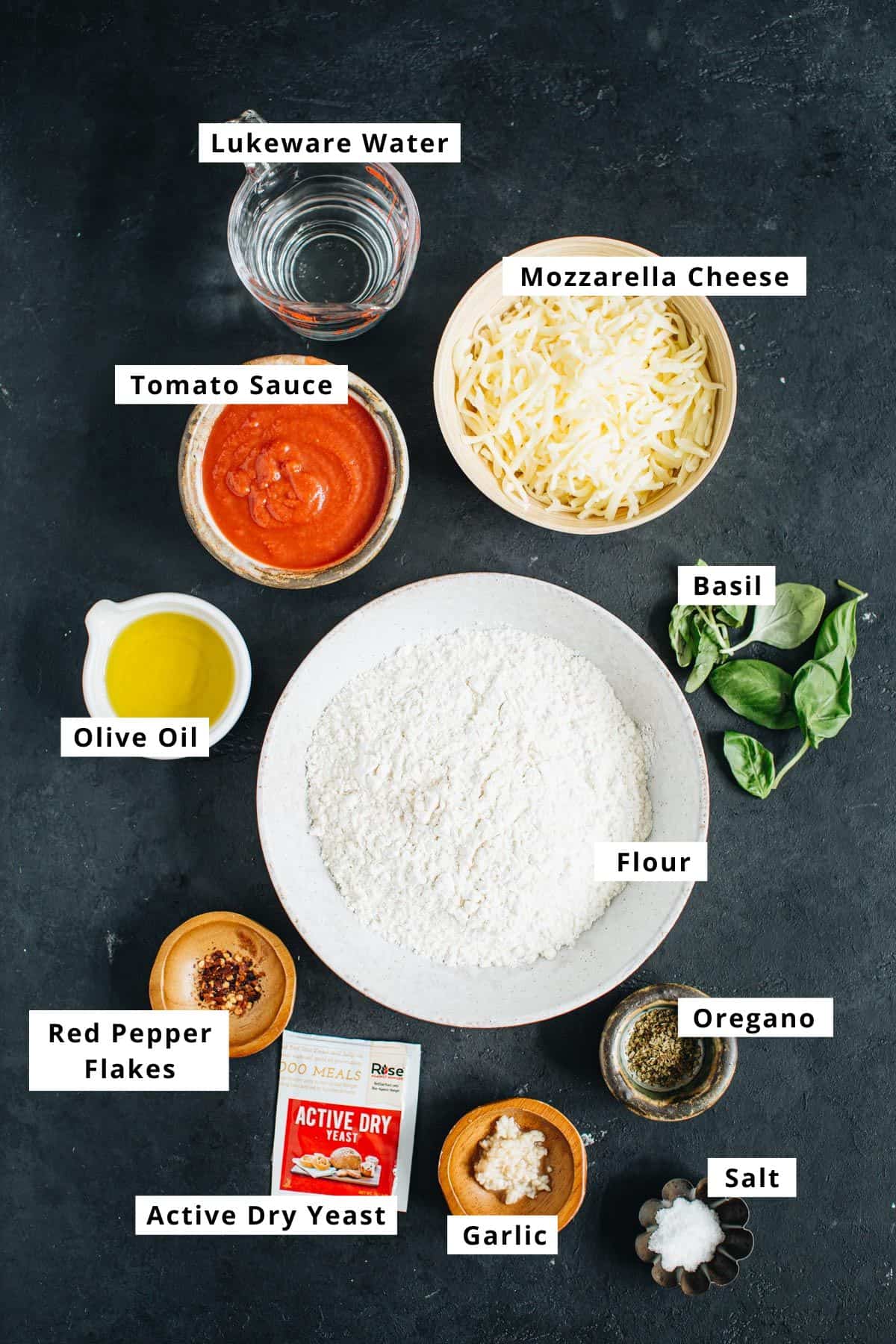 Skillet pizza recipe ingredients in various bowls.