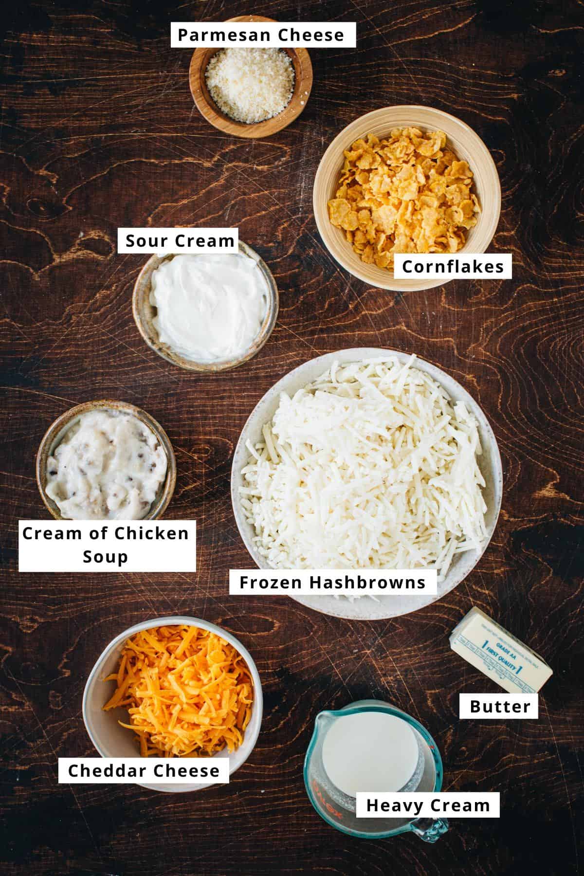 Cheesy hashbrown casserole ingredients in various bowls.