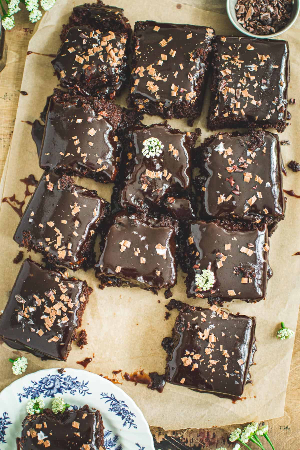 Coca Cola cake slices on brown parchment paper.