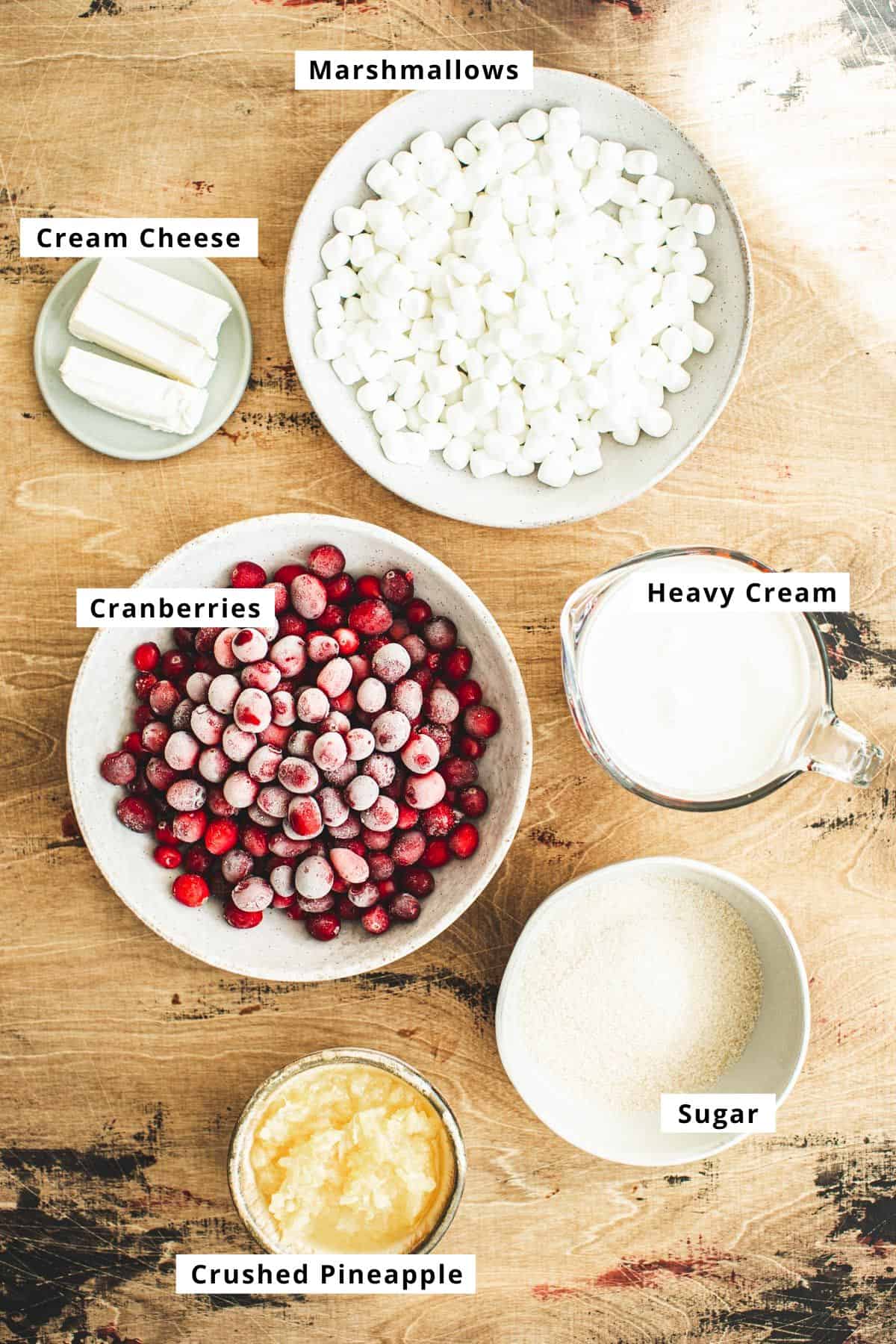 Cranberry fluff salad ingredients in various bowls.