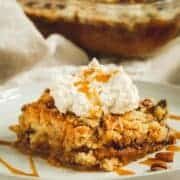 Pumpkin pie dump cake on a white plate.
