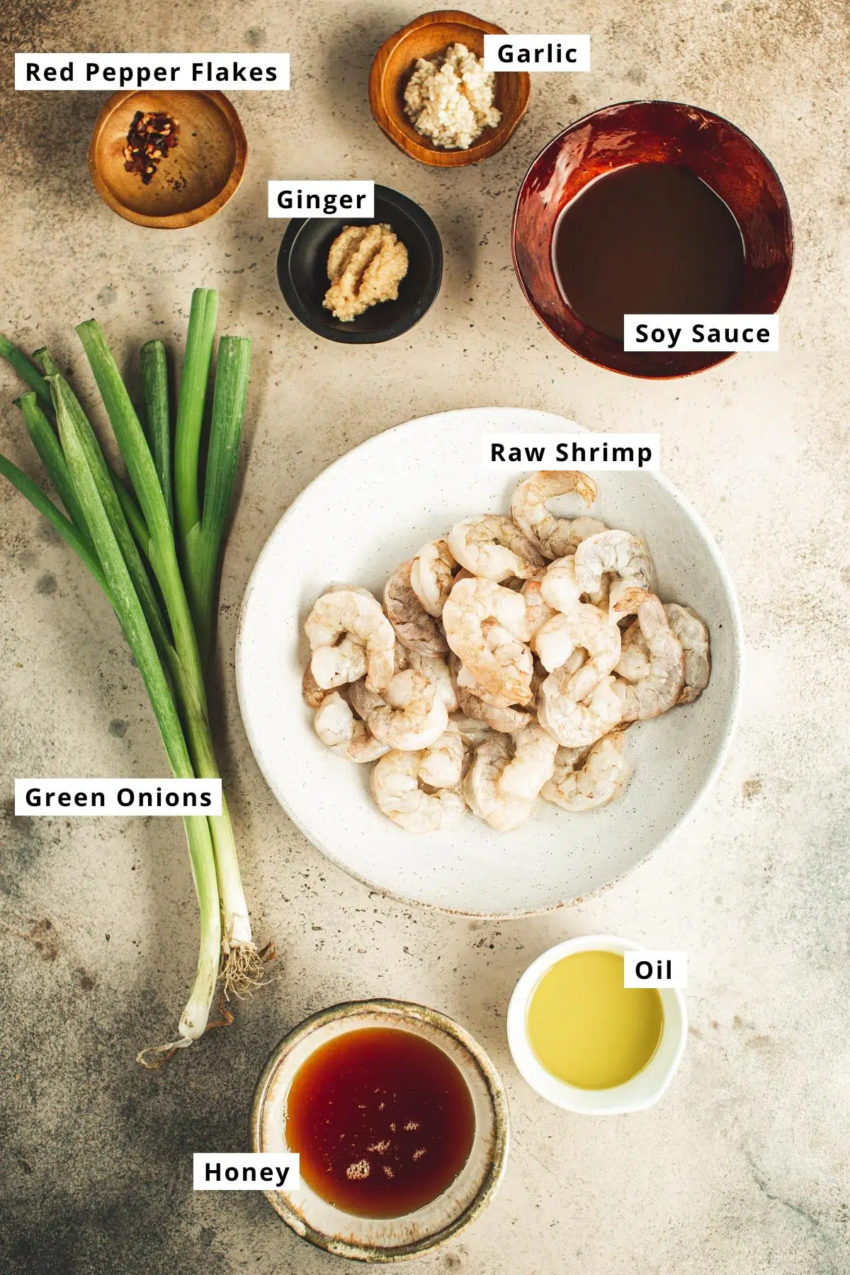Honey garlic shrimp ingredients in various bowls.
