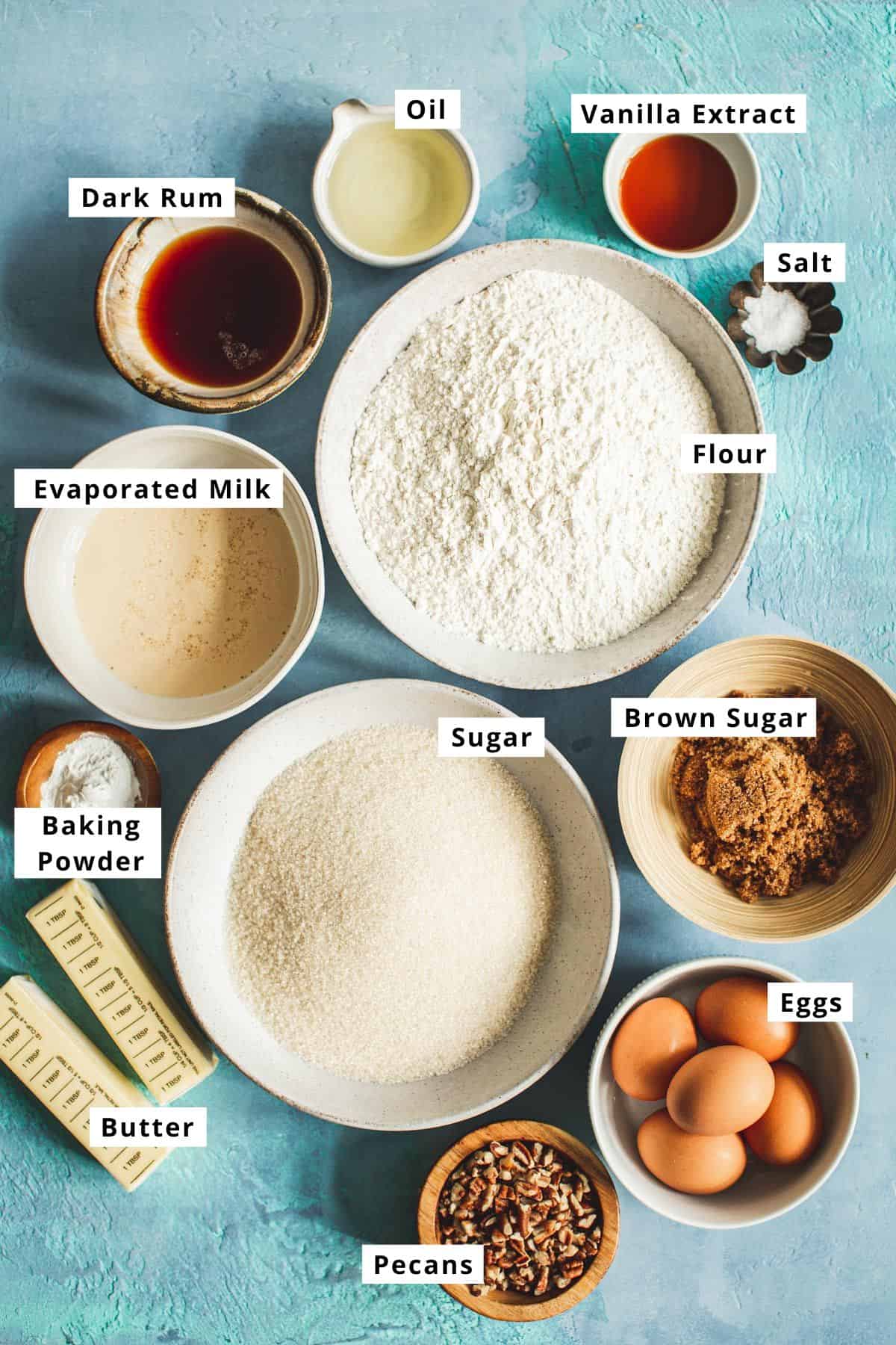 Jamaican rum cake ingredients in various bowls.