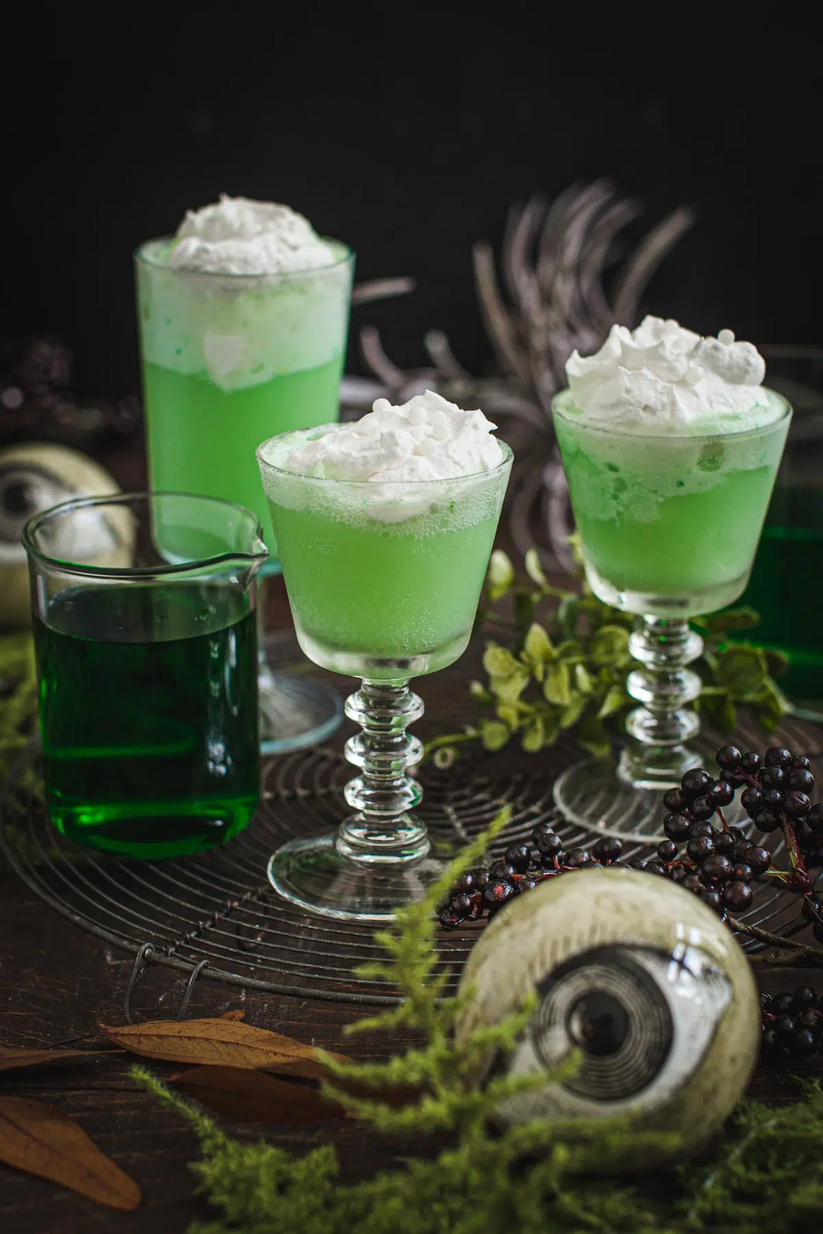 Harry Potter polyjuice potion in glasses topped with whipped cream.