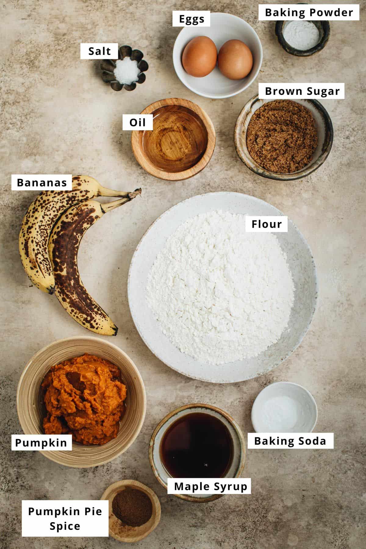 Pumpkin banana bread ingredients in various bowls.