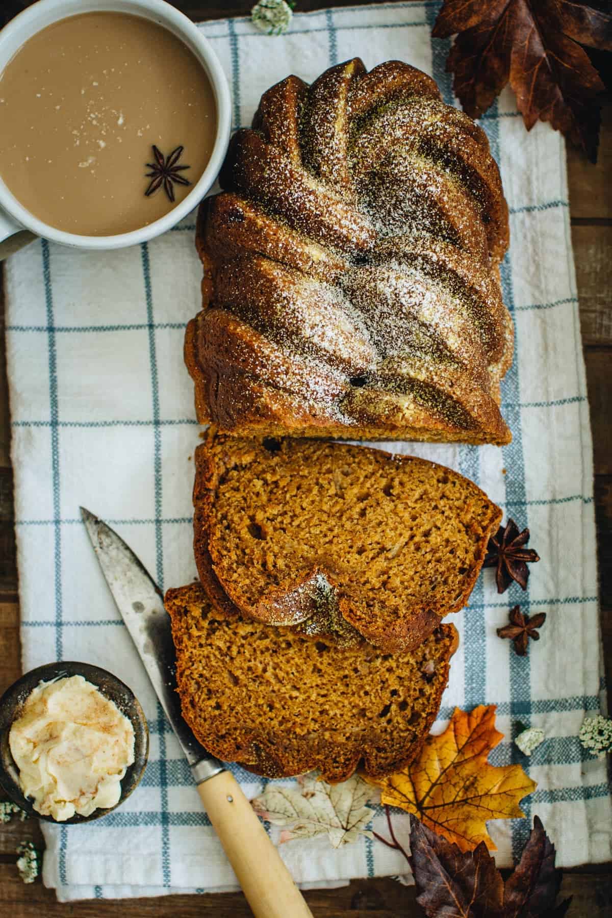 Pumpkin banana bread sliced with powdered sugar on top.