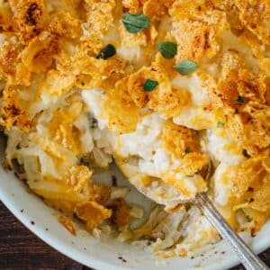 Cheesy hashbrown casserole with a cornflake topping.