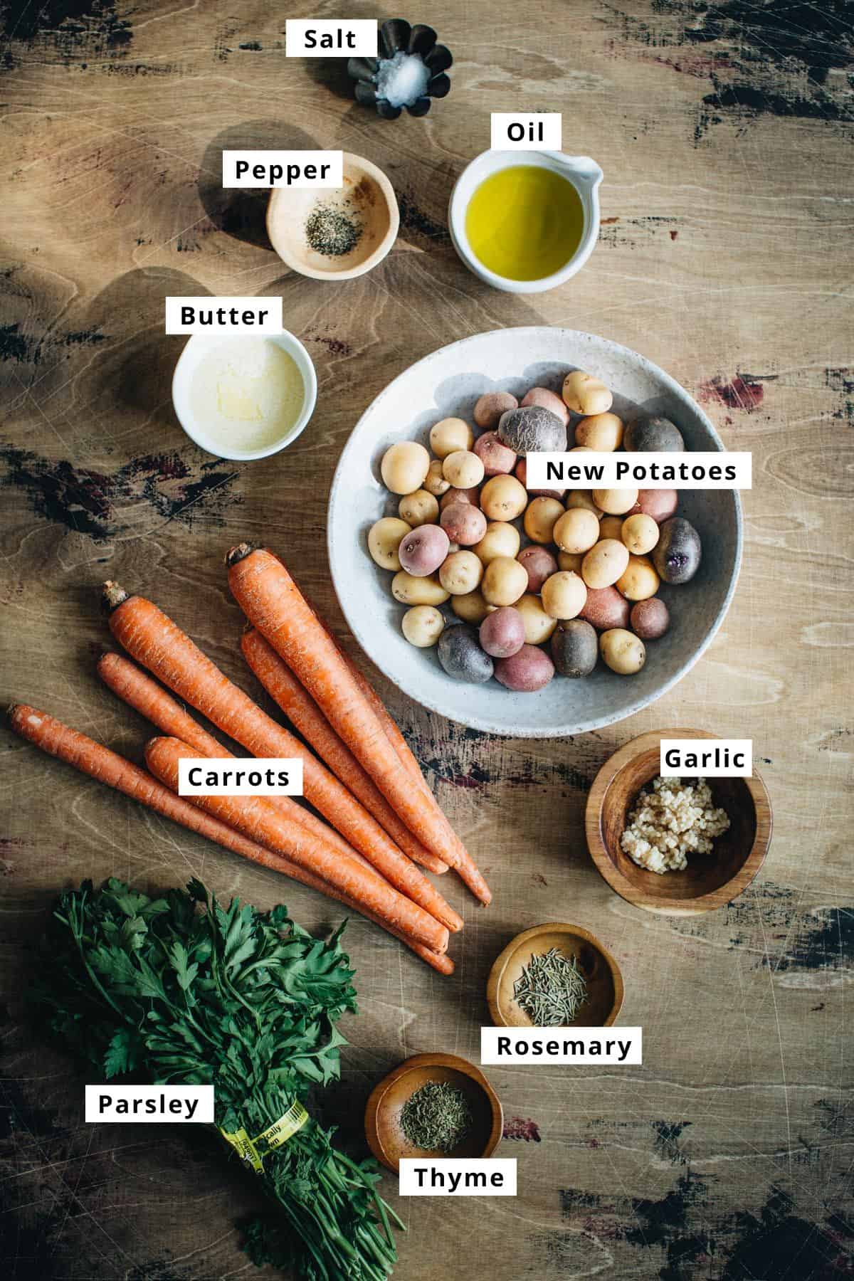 Sheet pan potatoes and carrots ingredients in various bowls.