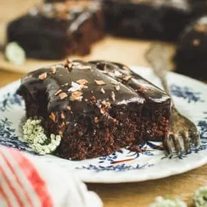 Slice of Coca Cola cake with a fork next to it.