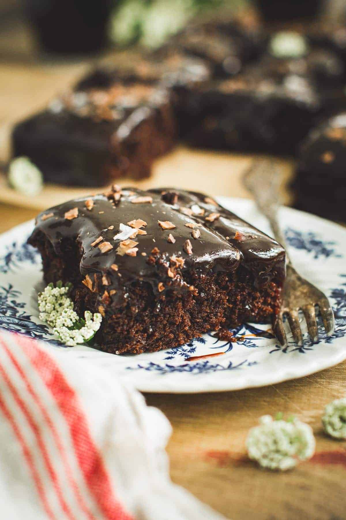 Slice of Coca Cola cake with a fork next to it.