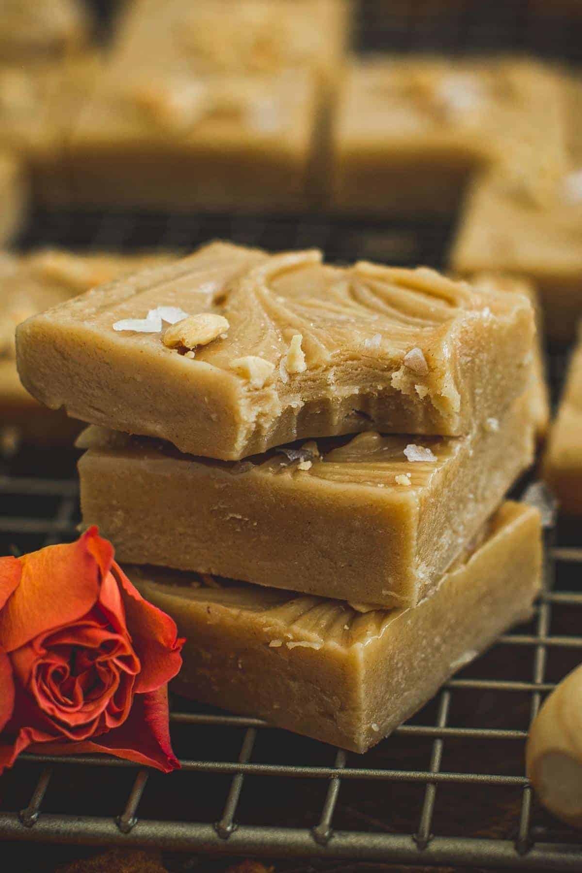 Homemade peanut butter fudge in a stack.