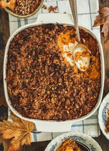 Sweet potato soufflé in a square casserole dish.