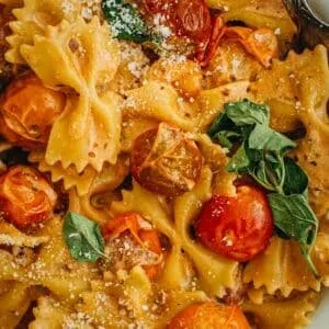 Creamy bow tie pasta topped with fresh parmesan and oregano.