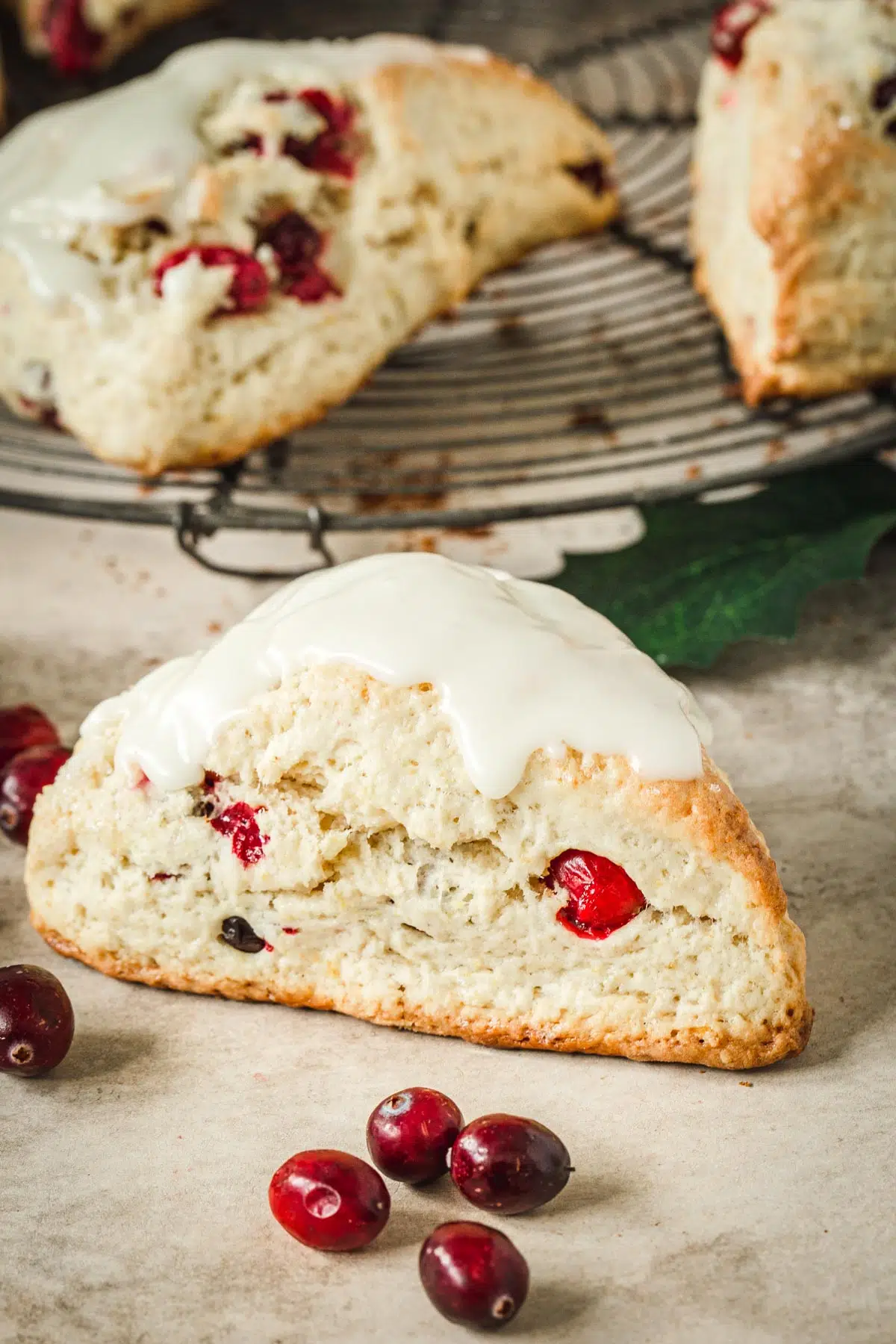 Cranberry orange scones with a glaze on top.