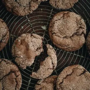 Devil's food cake cookies on a wire rack.