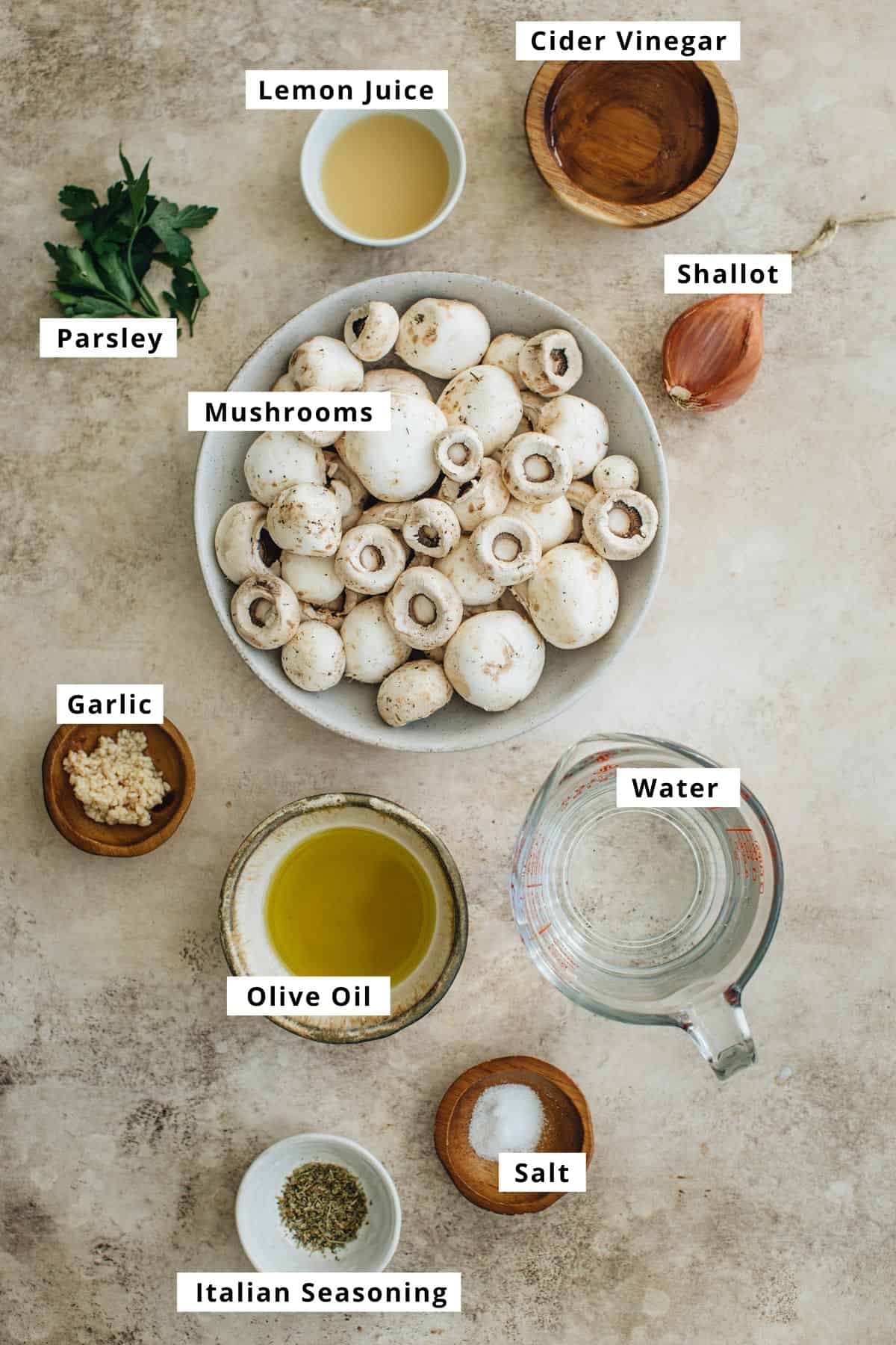 Easy marinated mushrooms ingredients in various bowls.