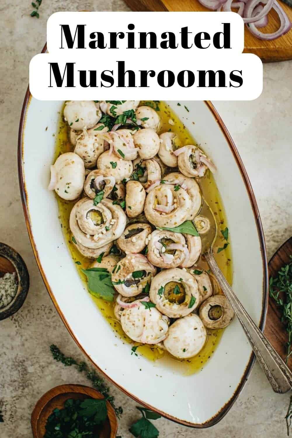 Easy marinated mushrooms in an oval bowl.