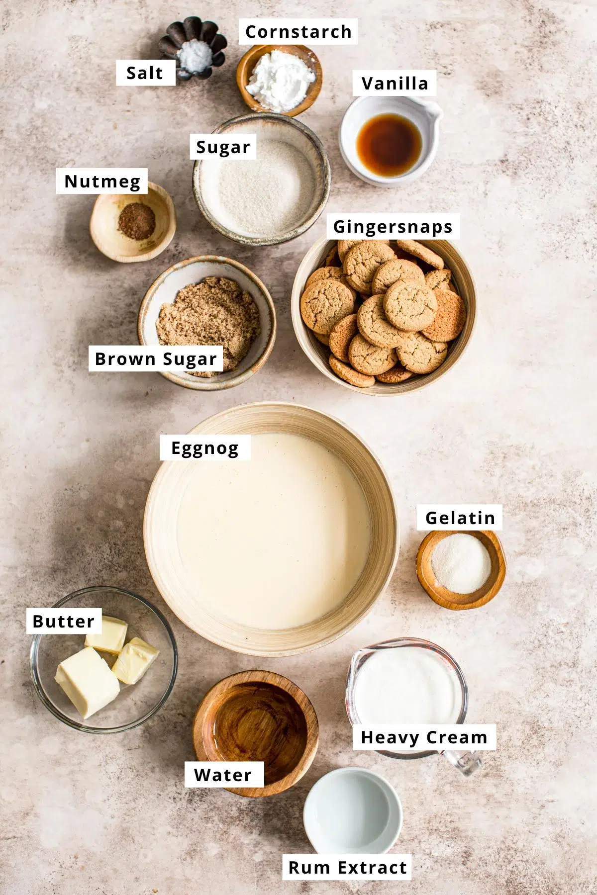 Eggnog pie recipe ingredients in various bowls.