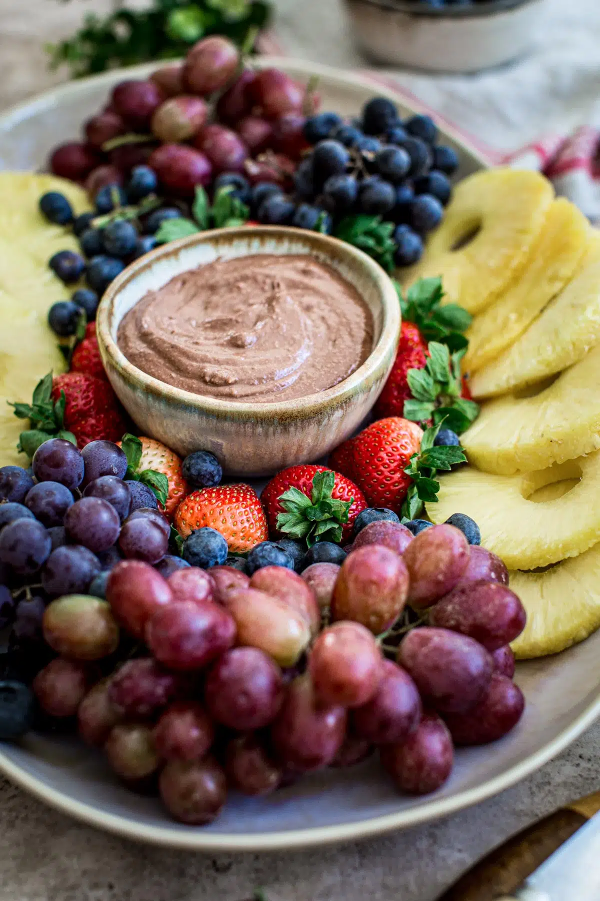 Fresh fruit tray with chocolate dip in the center.