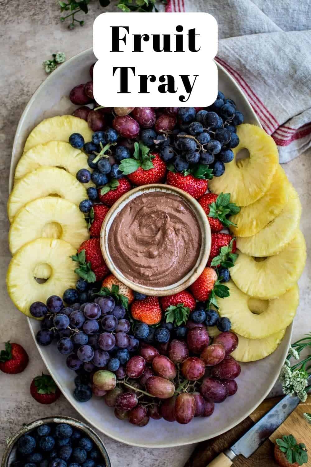 Fresh fruit platter with chocolate dip in the center.