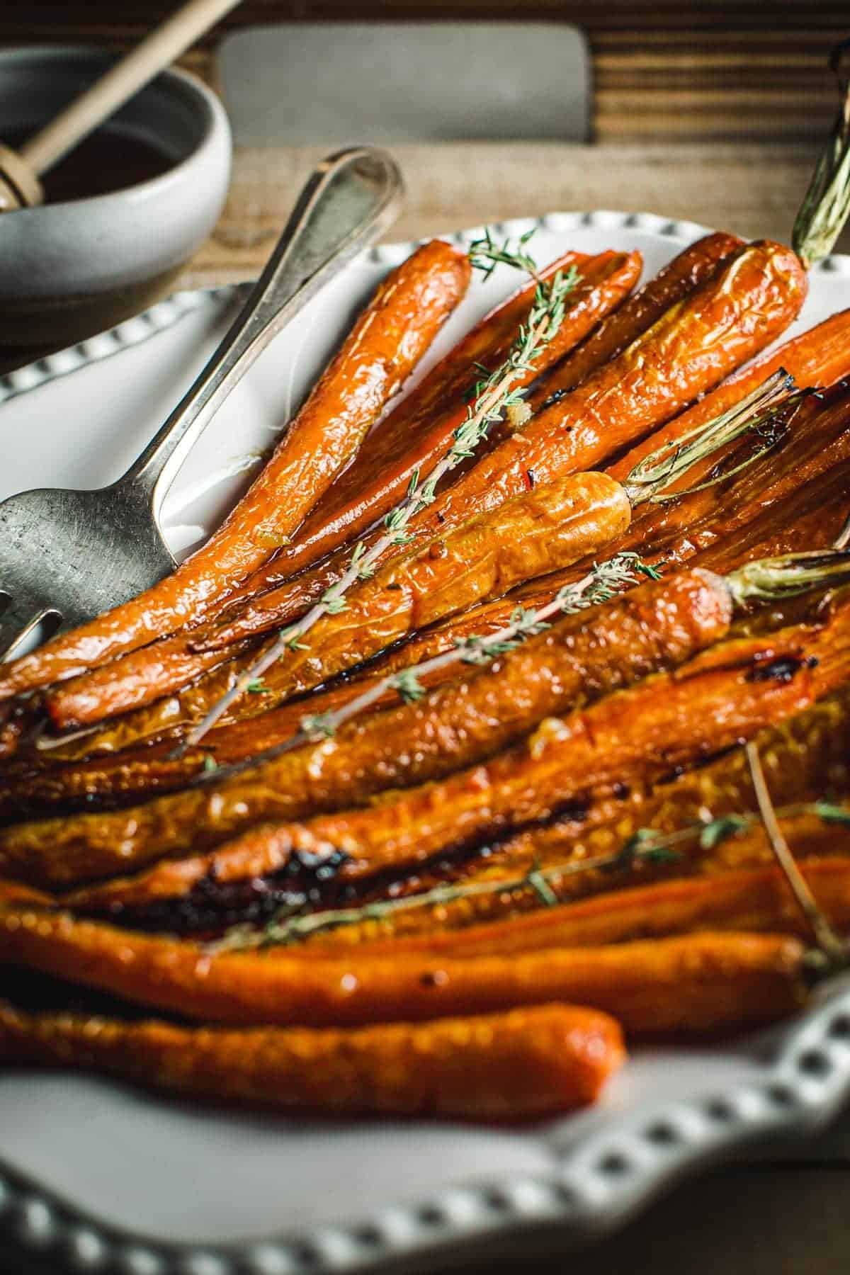 Oven roasted carrots with honey and fresh thyme on top.