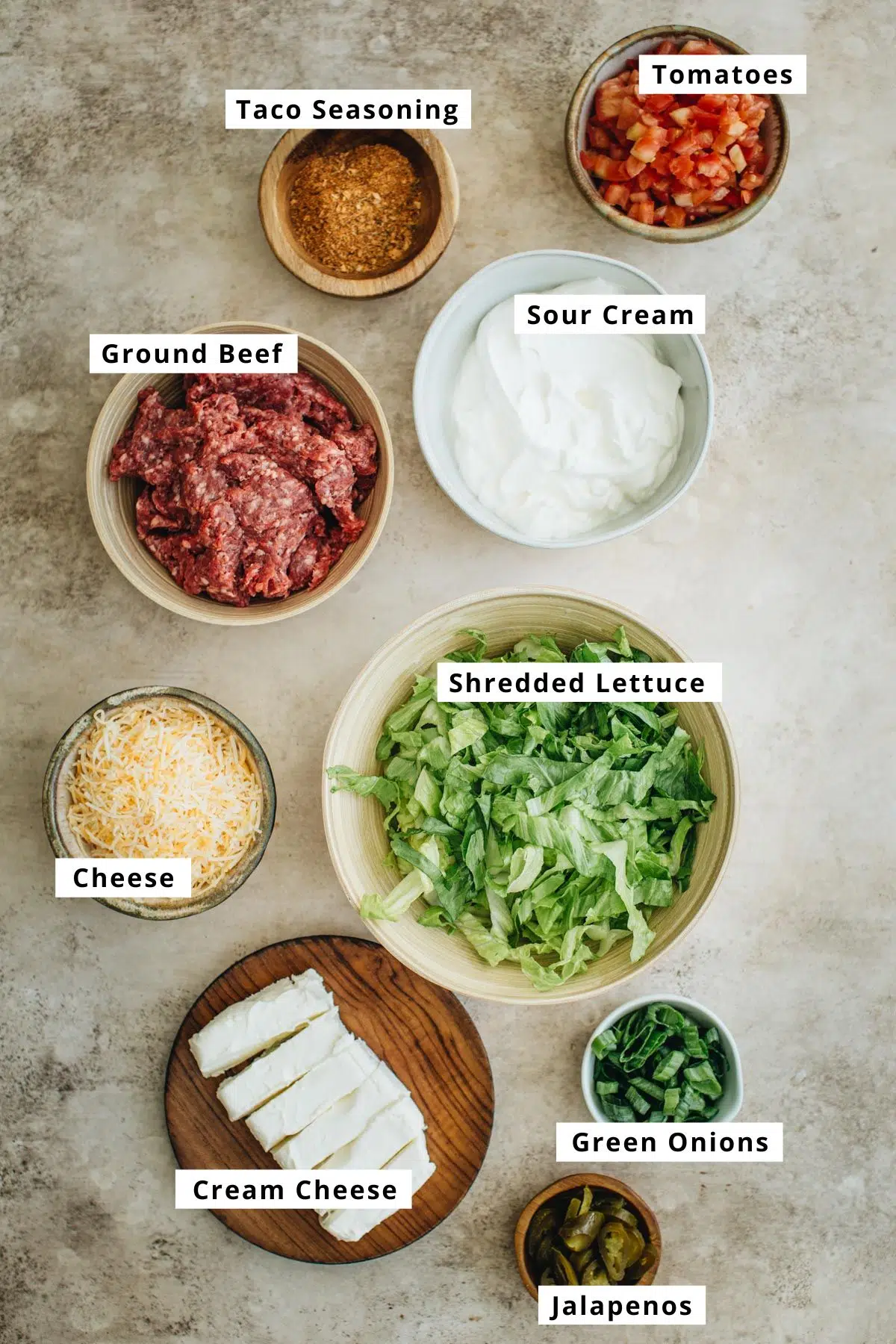 Layered taco dip ingredients.