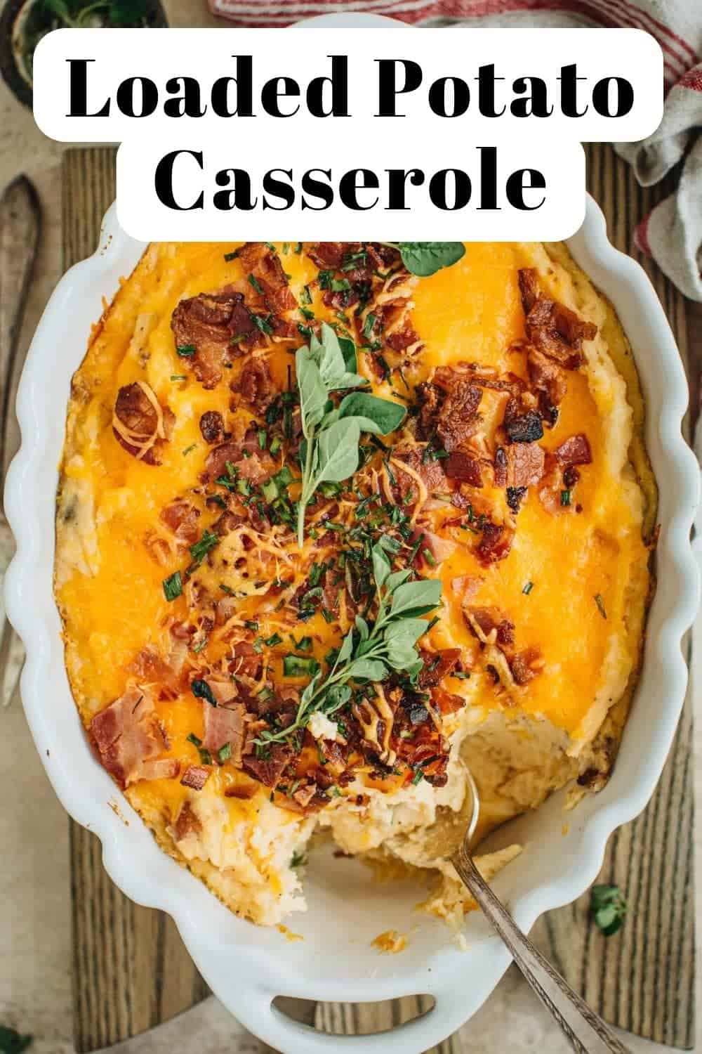 Loaded potato casserole in a white casserole dish.