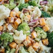 Broccoli cauliflower salad in a wooden bowl.