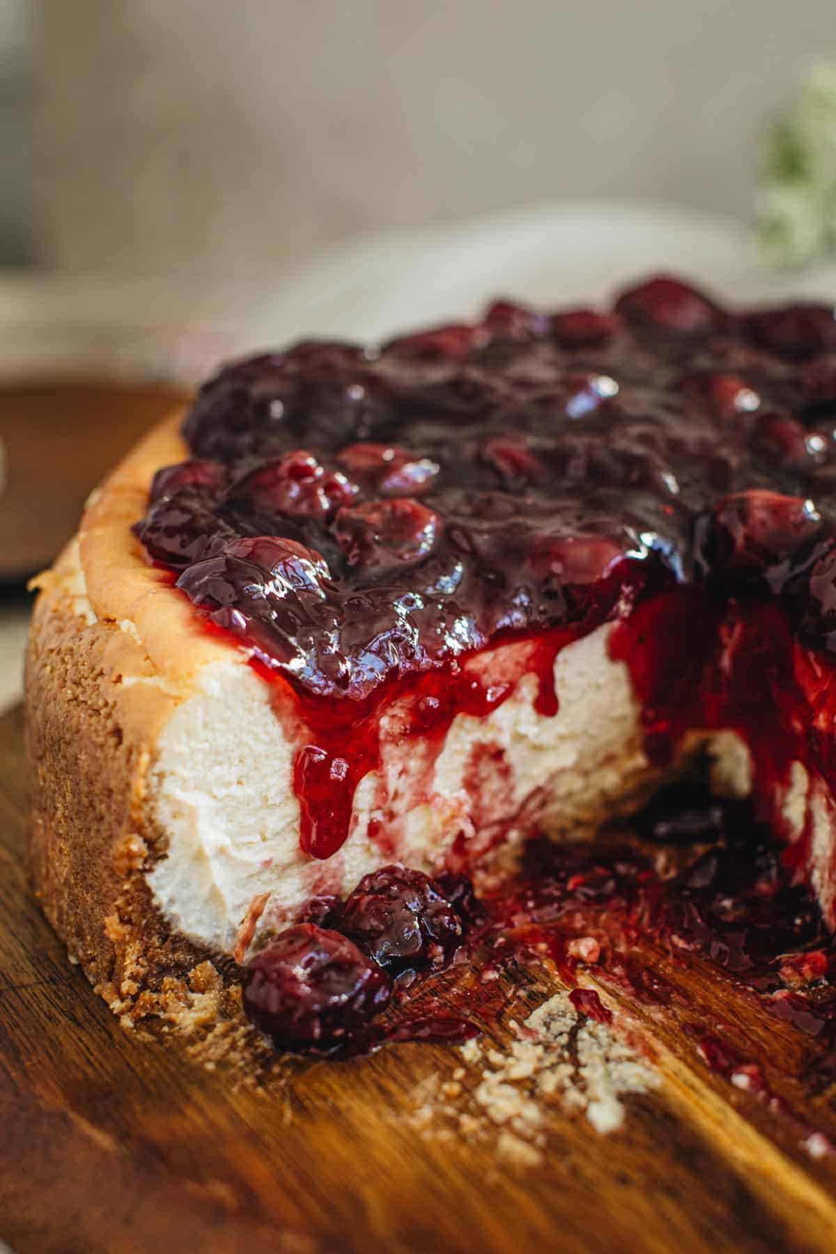 Easy cherry cheesecake with slice cut out.