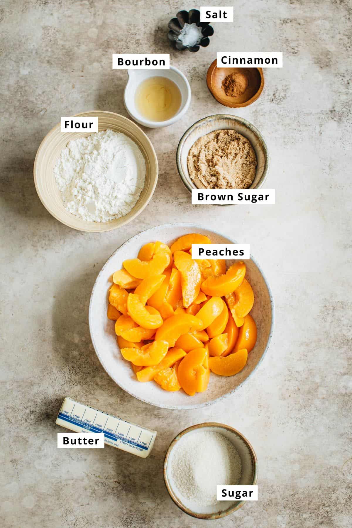 Easy peach crumble ingredients in various bowls.
