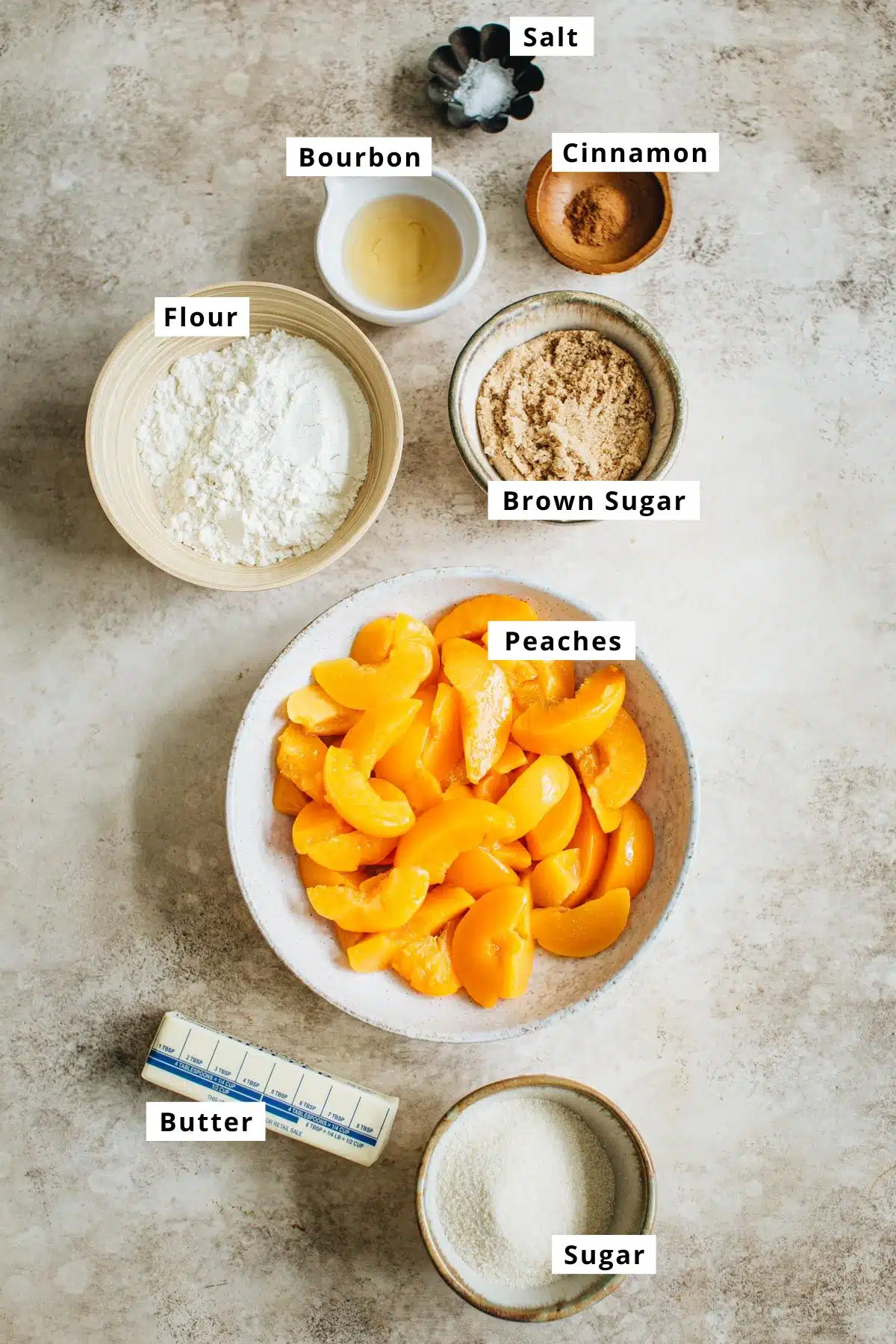 Easy peach crumble ingredients in various bowls.