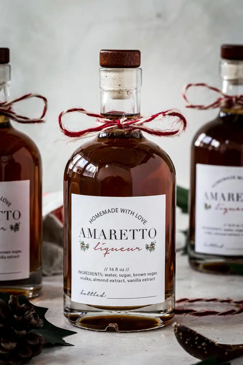 Homemade amaretto in a bottle with a homemade label.