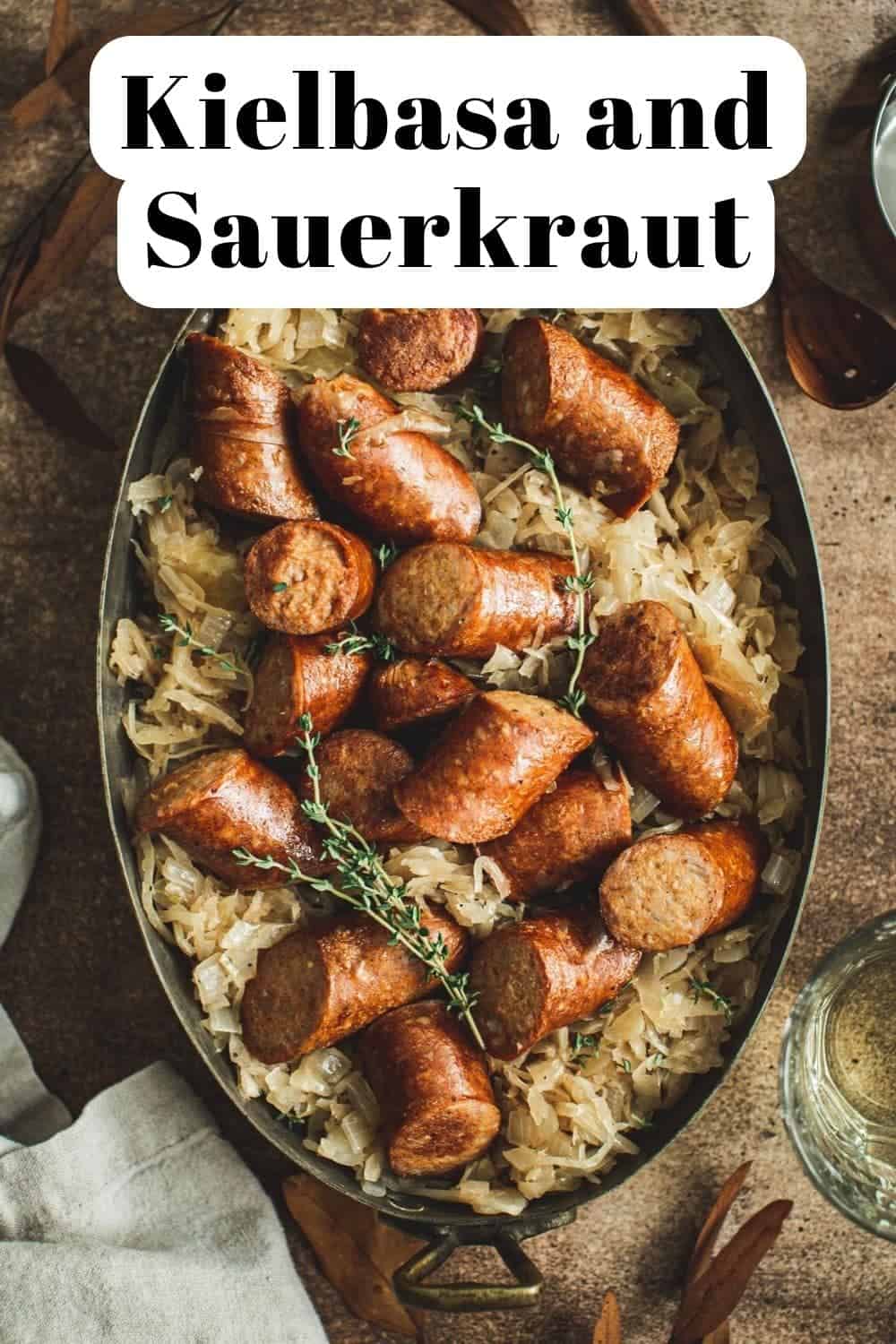 Polish sausage and sauerkraut in an oval pot.