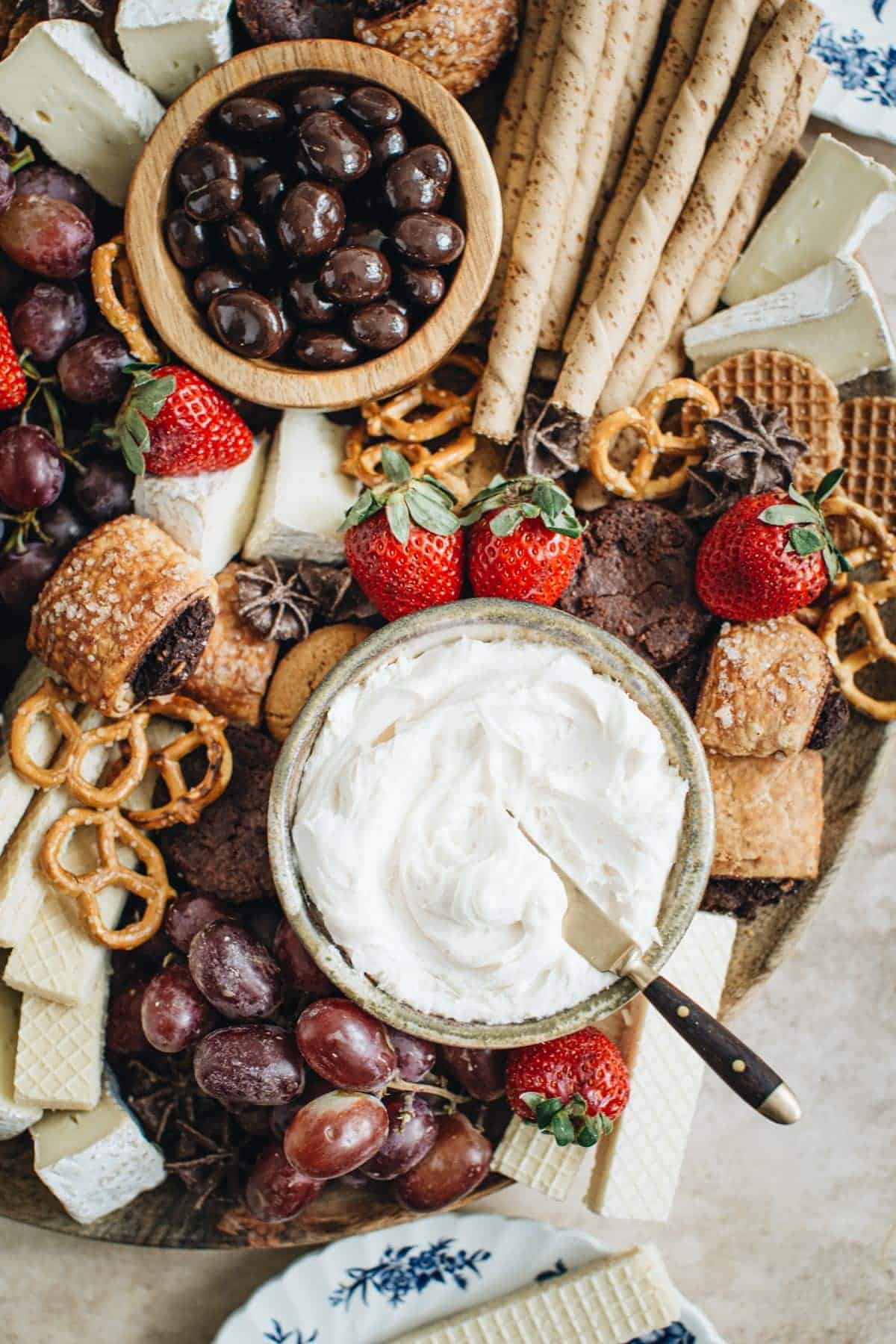 Valentines dessert charcuterie board with frosting for dip.